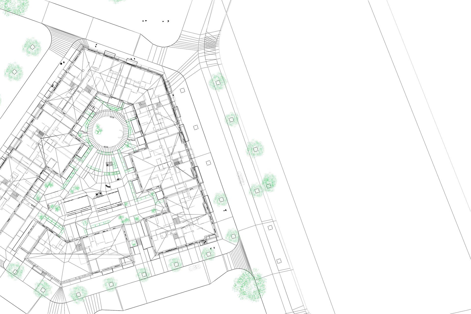 Architectural floor plan of a multi-story building with central courtyard and surrounding streets, with trees.