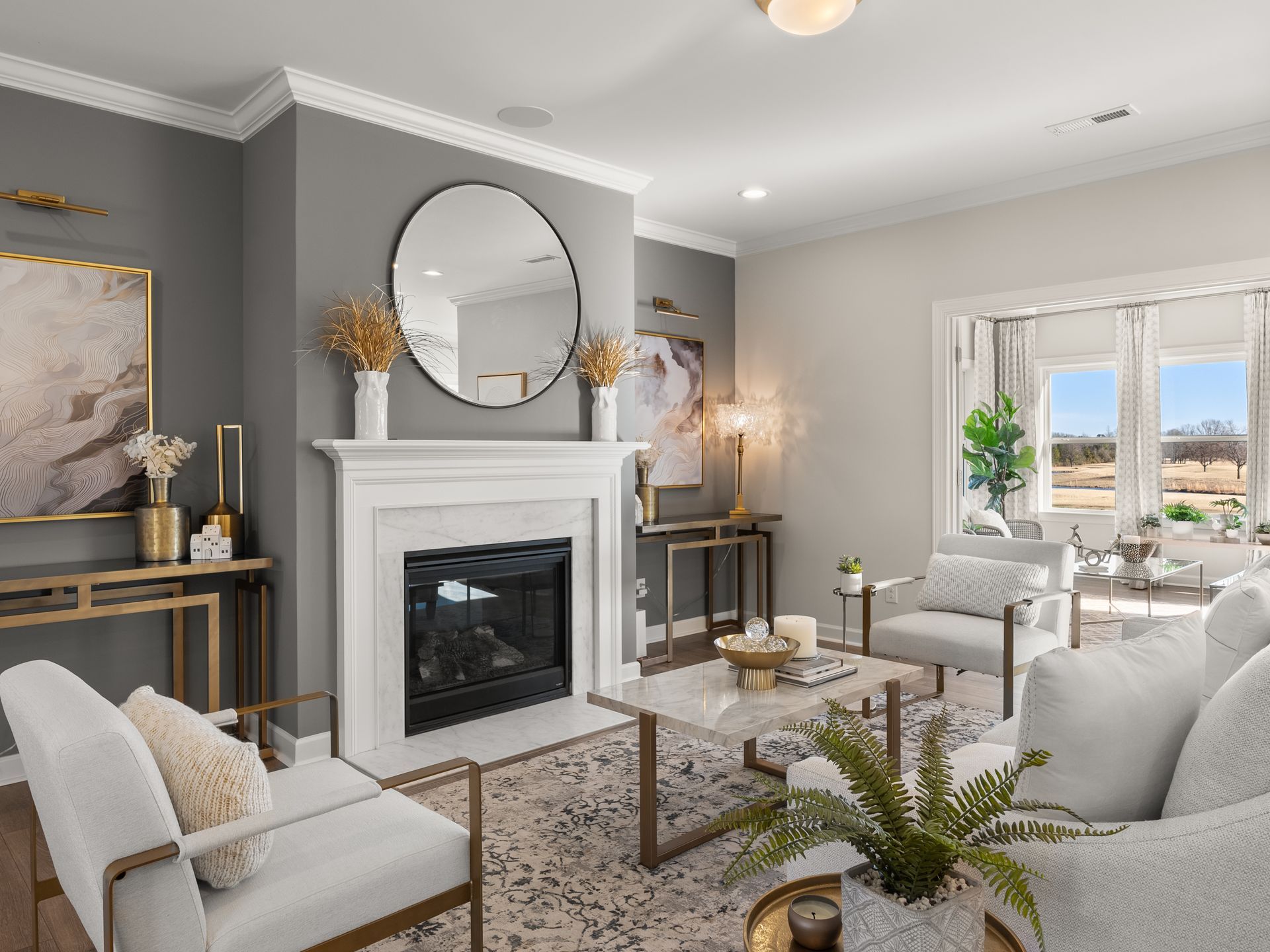 There is a fireplace in the middle of the living room.