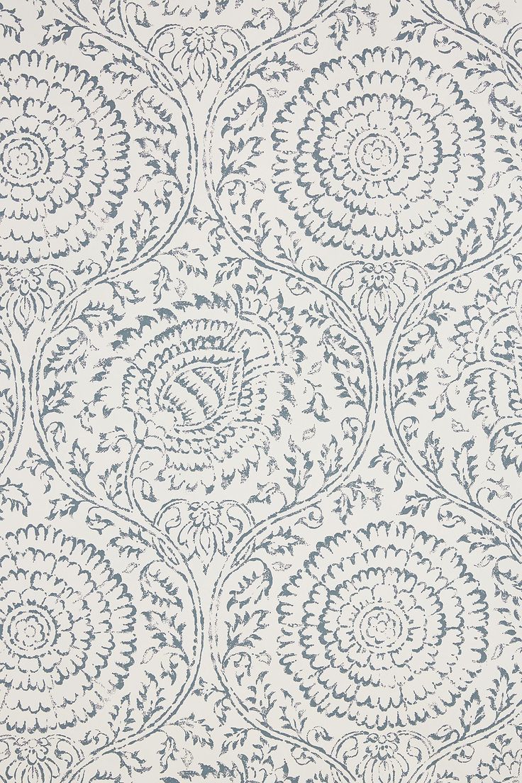 A close up of a white and blue rug with a pattern on it.