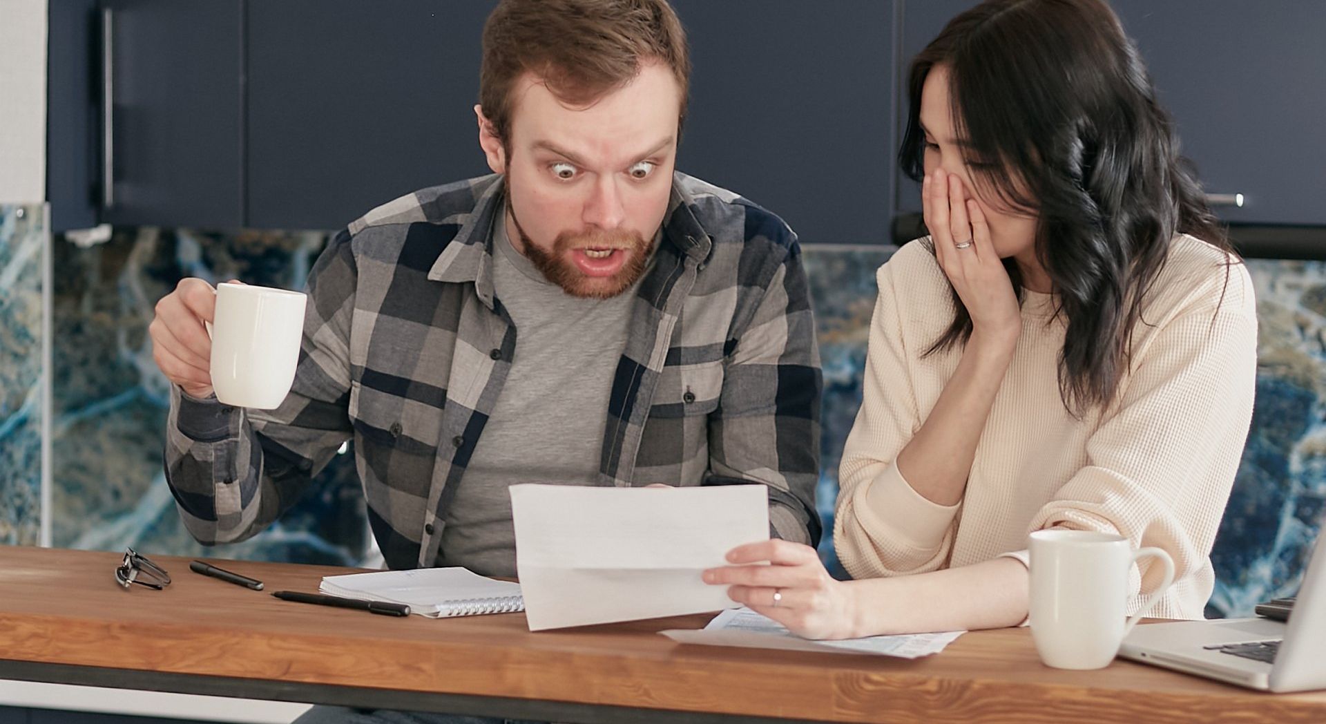 Residents looking at HOA document looking frustrated - Empower HOA Web and Software Solutions