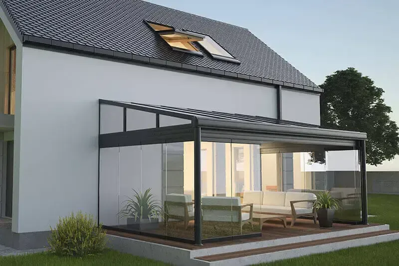 A white house with a pergola on the side of it.