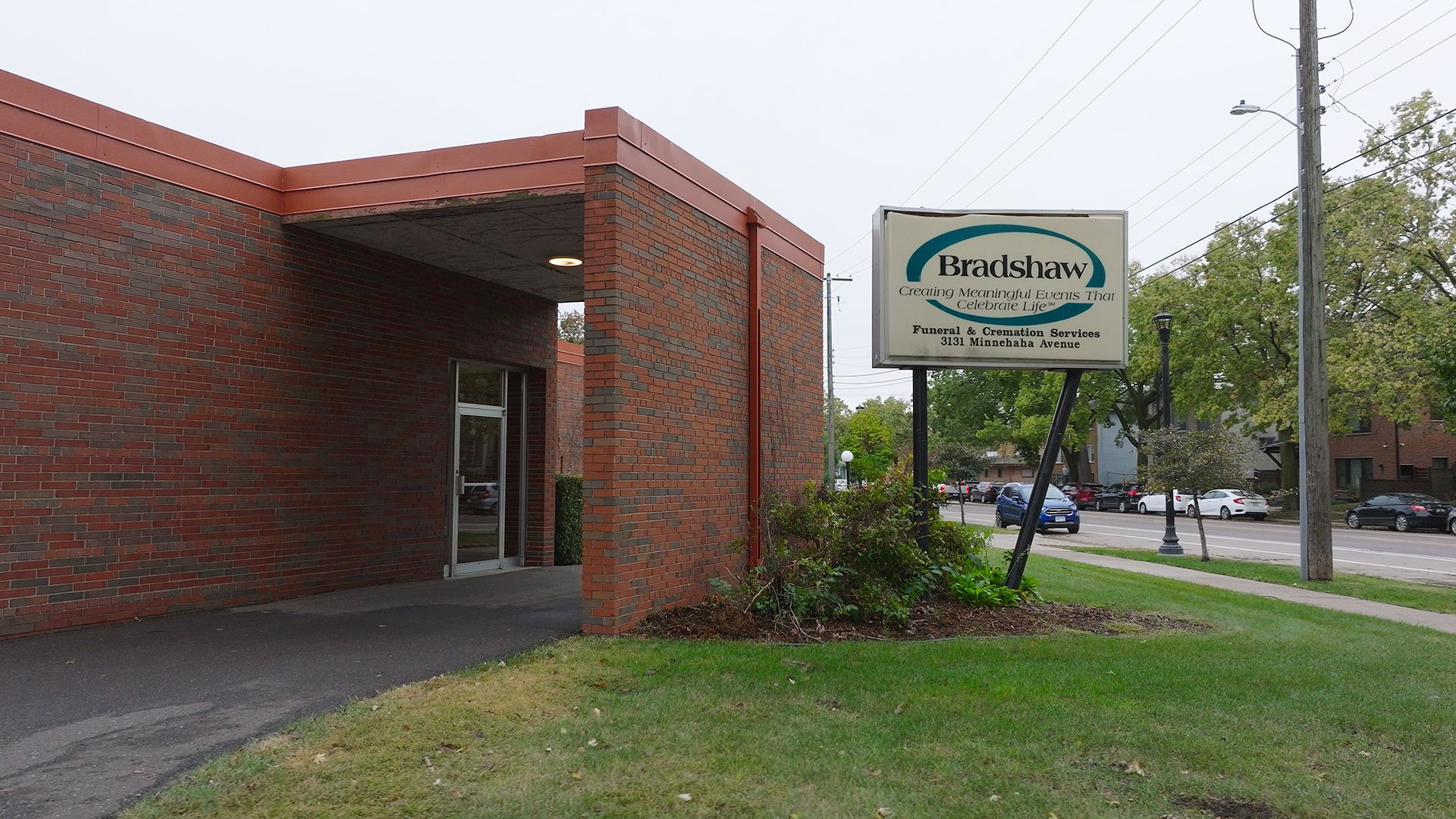 Brick building with a sign for