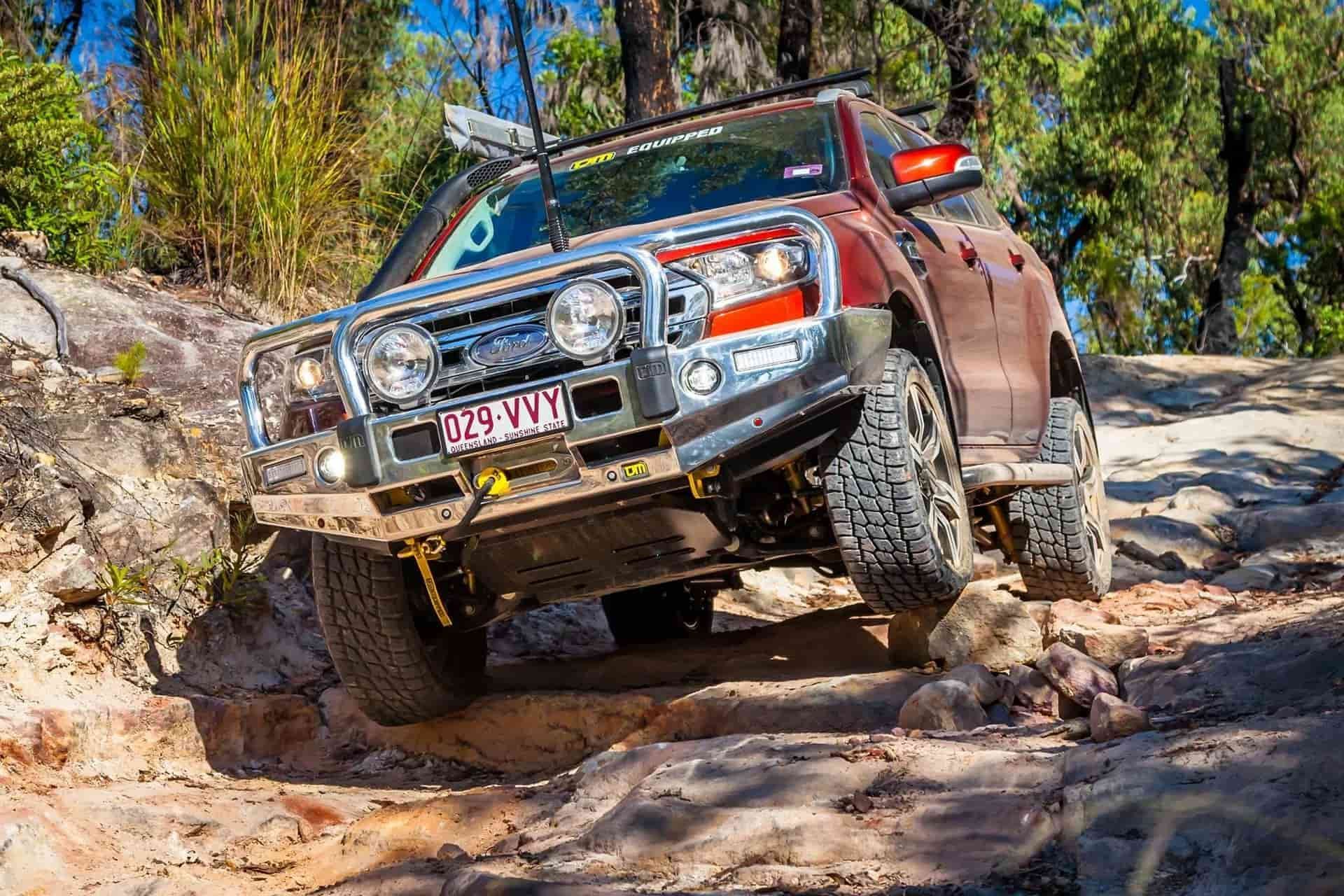 Red Ford 4WD Vehicle Off-Roading On Rocky Terrain In Albury