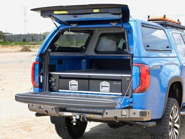 A Blue Truck With the Trunk Open is Parked in the Dirt — TJM Albury Pty Ltd in South Albury, NSW