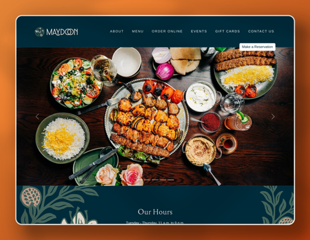 A tablet screen shows a table topped with plates of food.