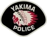 Yakima Police Department badge with Native American profile and headdress on black background.