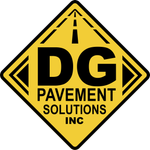 A yellow sign that says dg pavement solutions inc