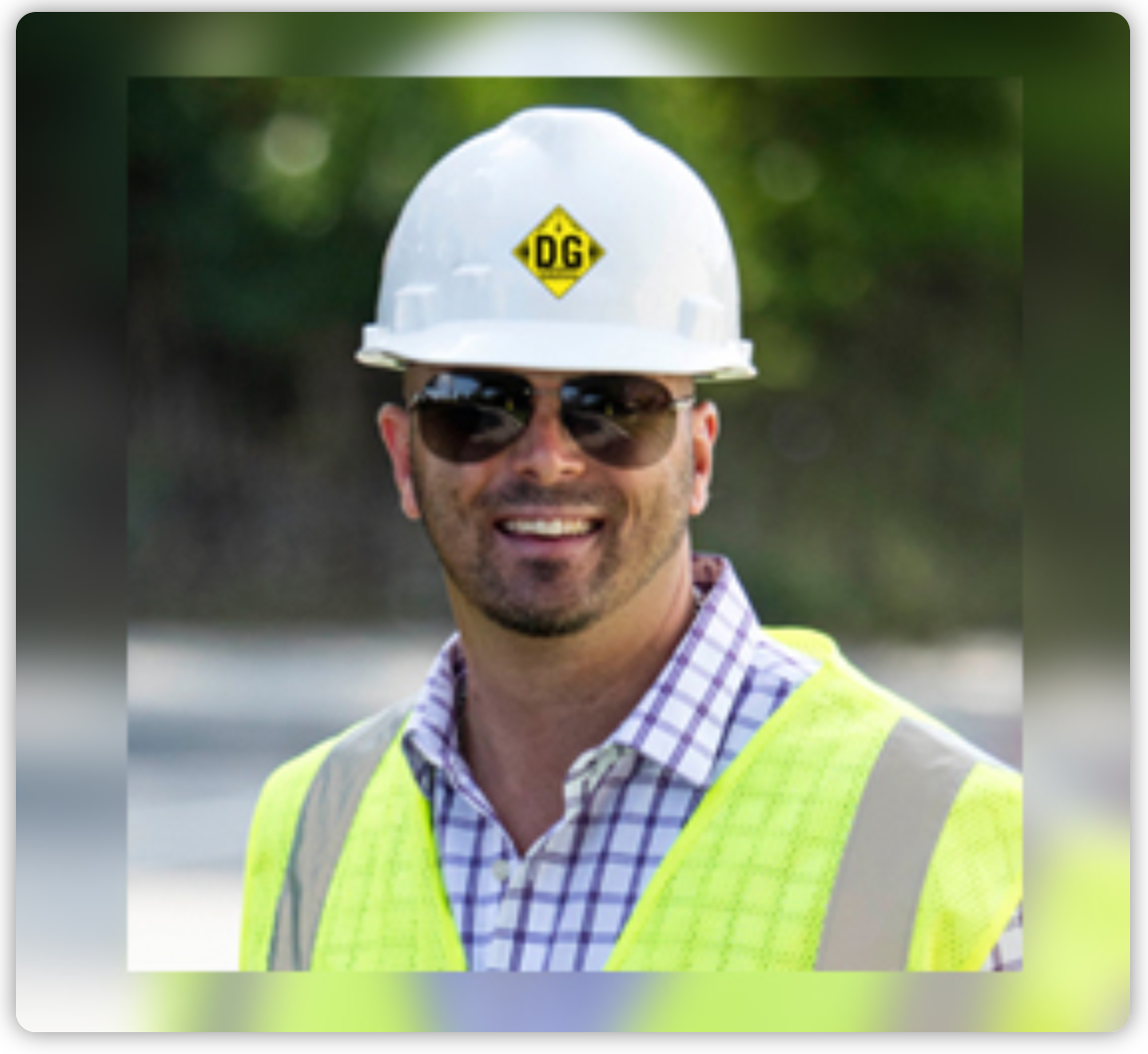 A man wearing a hard hat that says dg on it