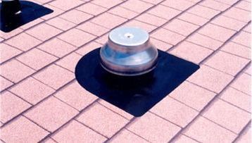 A roof with a stainless steel exhaust pipe on it