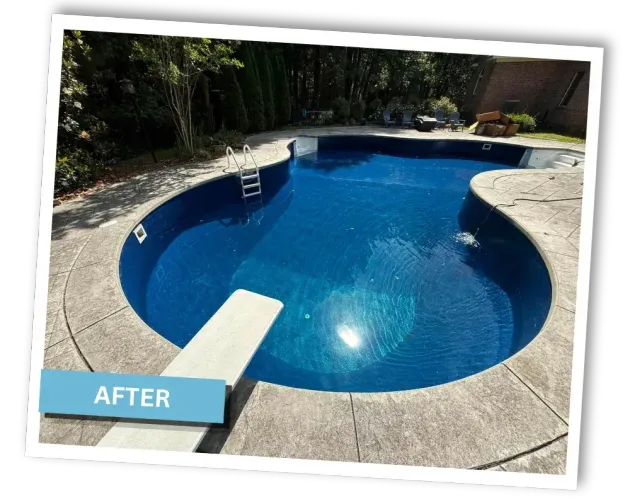 After photo of a blue backyard pool with diving board and surrounding stone deck