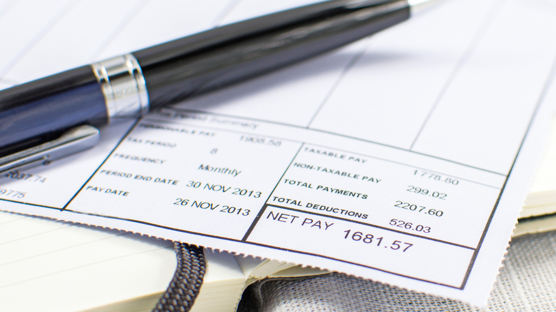 Wage garnishment printed on a white document on a wooden desk