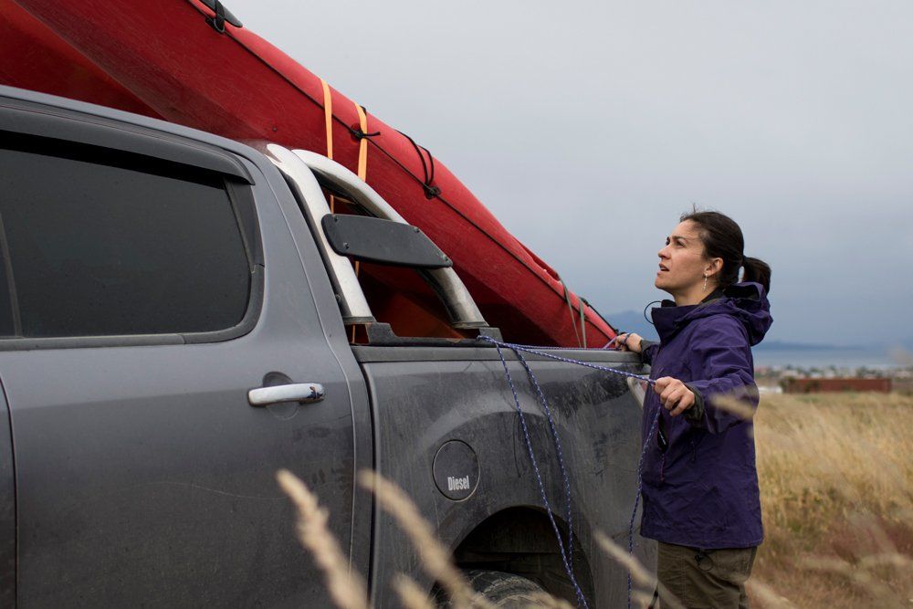 Securing A Kayak To A Pick Up Truck — Ogden, UT — Sam T Evans Pickup Cover & Trailer Sales Securing A Kayak To A Pick Up Truck — Ogden, UT — Sam T Evans Pickup Cover & Trailer Sales