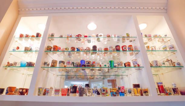 A display case filled with lots of bottles of perfume.