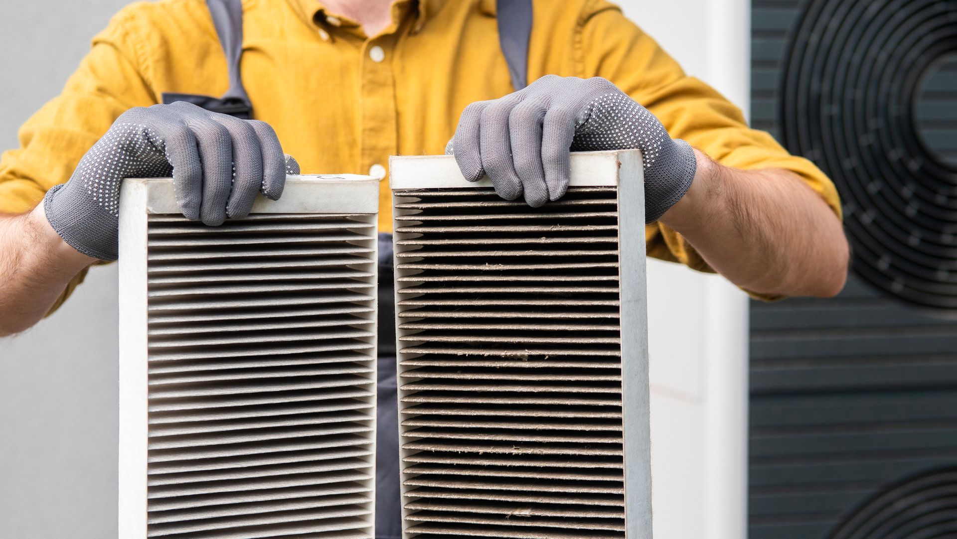 A clean HVAC air filter being installed into a system.