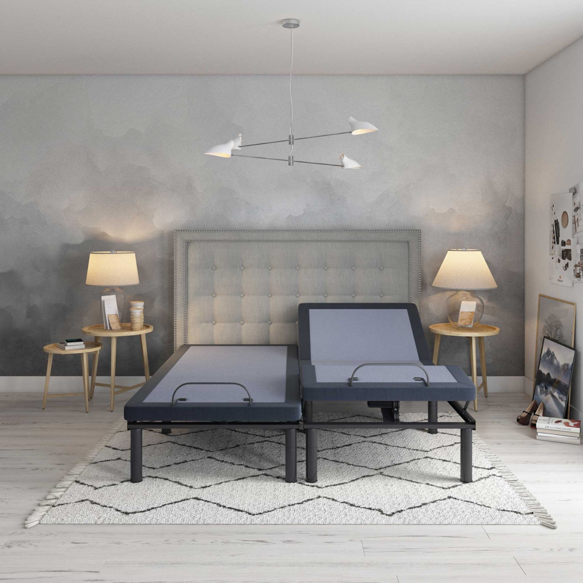 Adjustable bed in a bedroom setting with lamps, rug, and art.