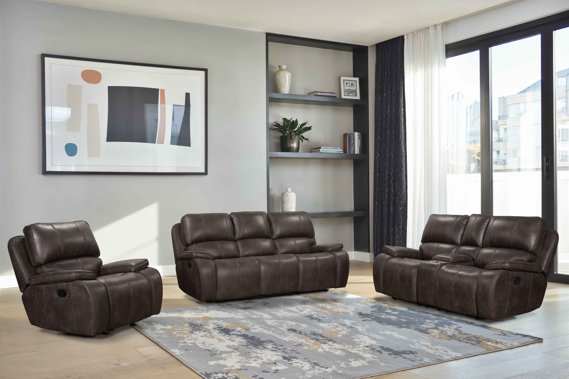 A dark brown leather living room furniture set, including a recliner, loveseat, and sofa, arranged on an area rug.