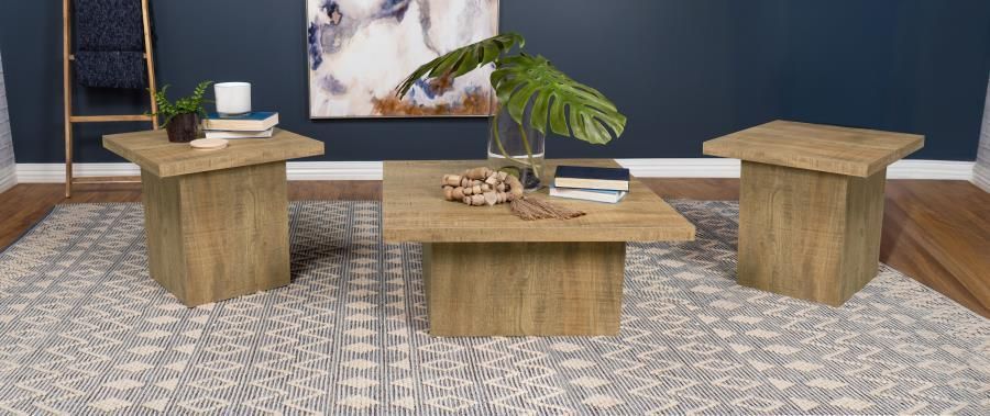 Living room with wood tables, a patterned rug, a ladder, and a dark blue wall.