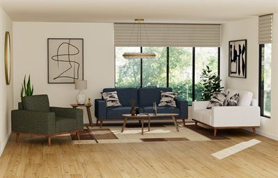 Living room with blue sofa, white armchair, green armchair, artwork, and window with outdoor view.