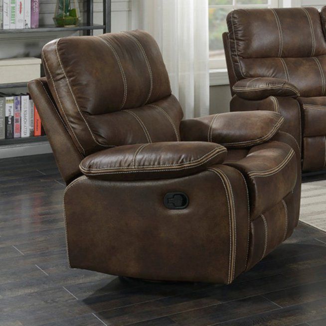 Brown leather recliner chair with light stitching, indoors.