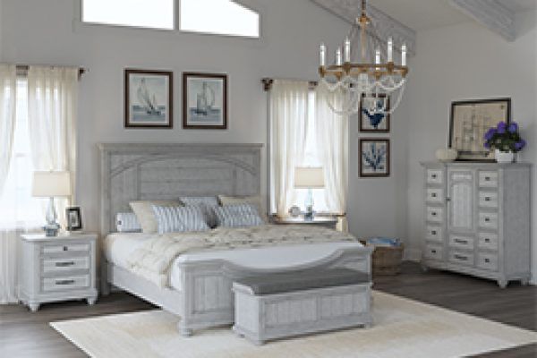 Bedroom with white distressed furniture, including a bed, nightstand, chest, and bench.