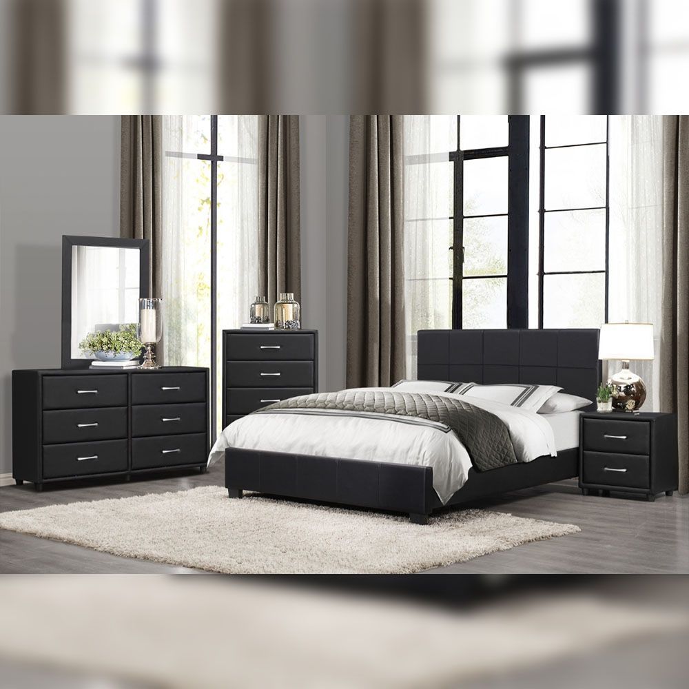 Bedroom set with black bed frame, dresser, nightstands, and mirror on a rug.