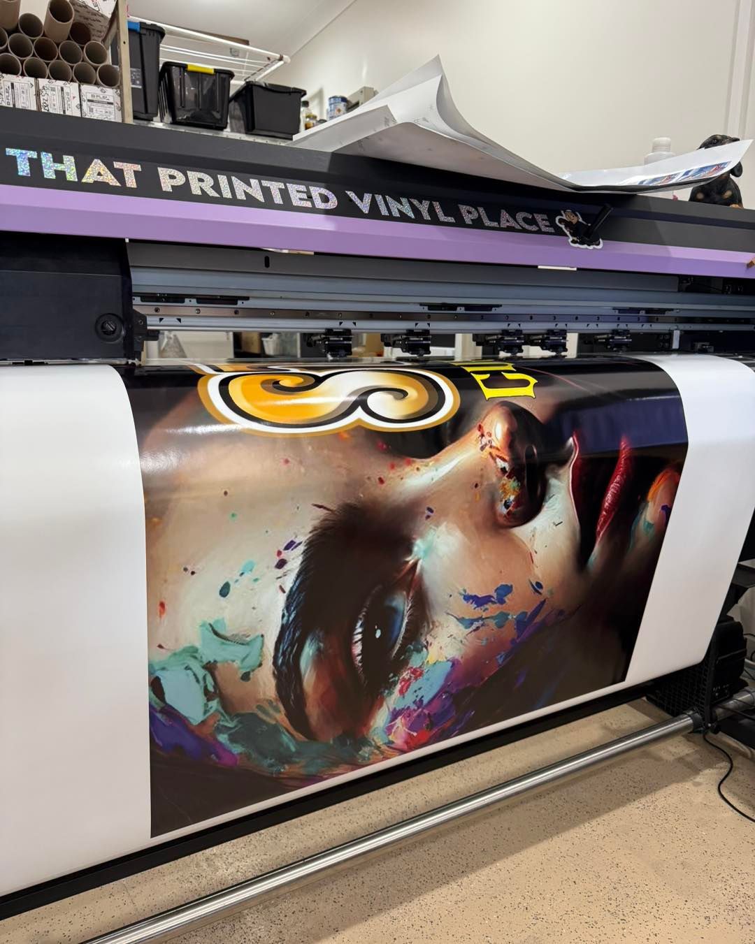 Large Format Printer Printing a Colorful Portrait Onto Vinyl — That Printed Vinyl Place in Heatley, QLD