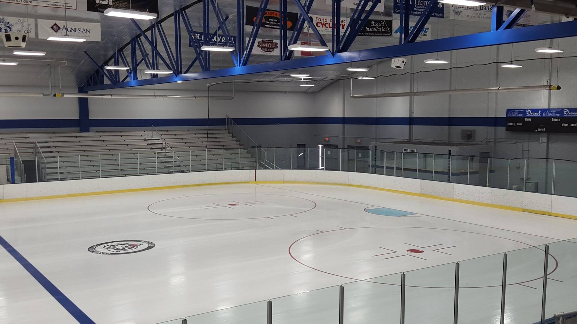 An empty room with brick walls and wooden beams.