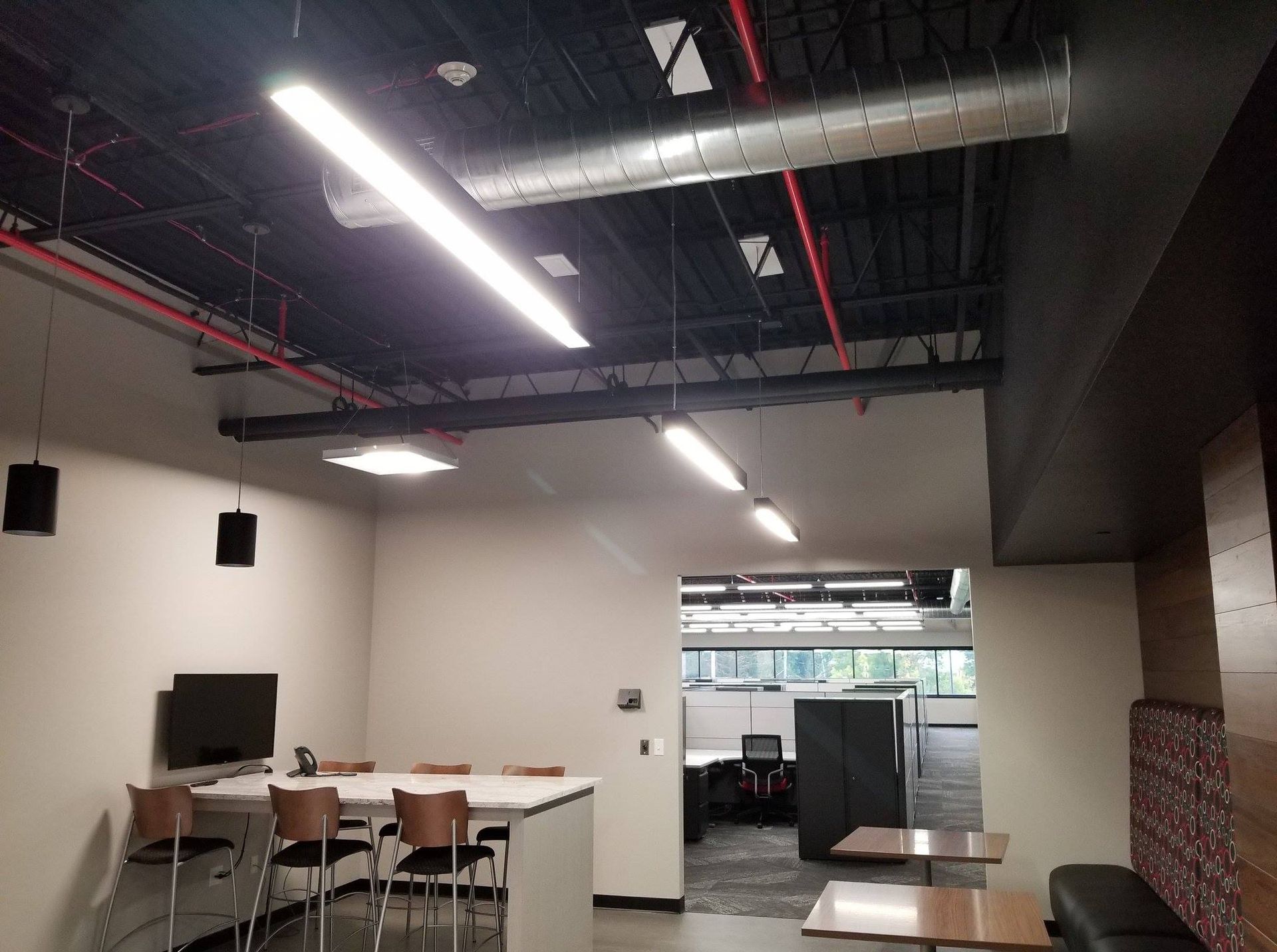 A large room with tables and chairs in it