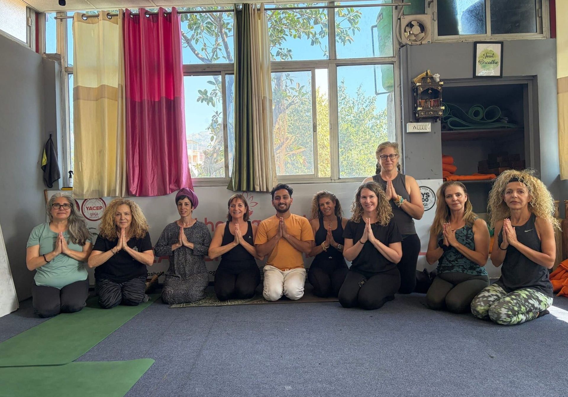 A practical guide to choosing the right yoga teacher training in India, from course length and location to certification and teaching quality.