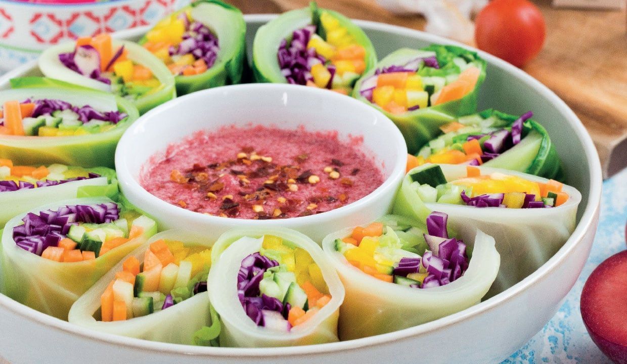 Colourful vegetable spring rolls wrapped in cabbage leaves and served with a sweet, gently spiced plum sauce.