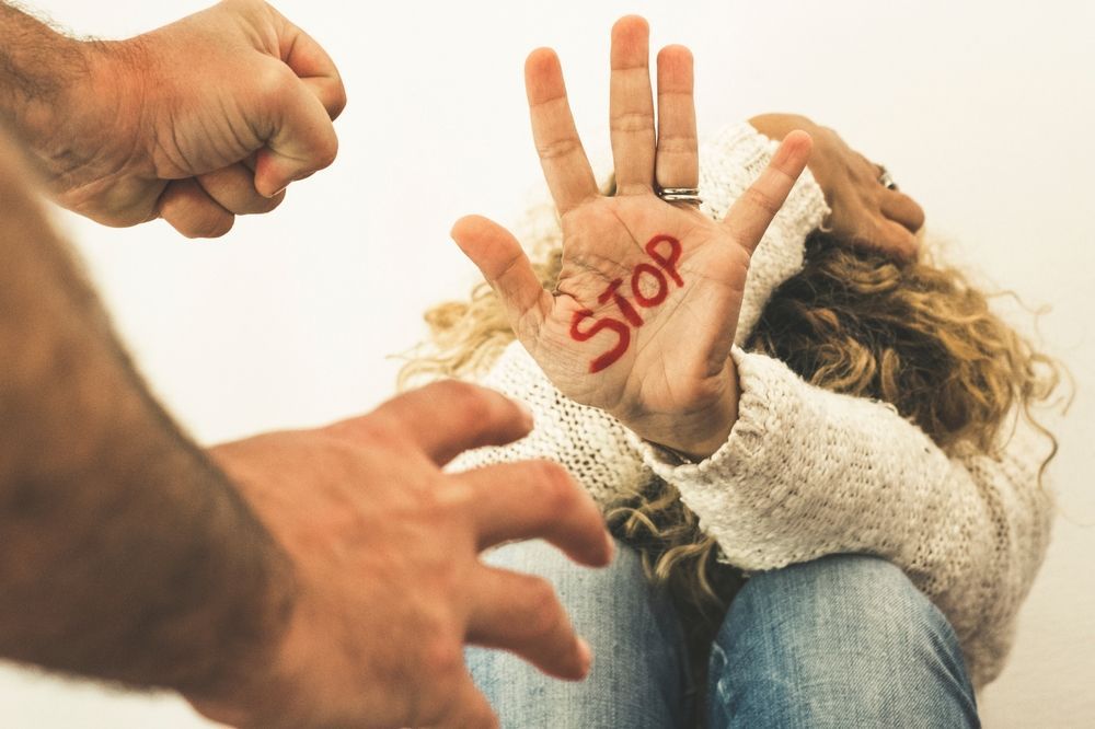 Person raises hand with 