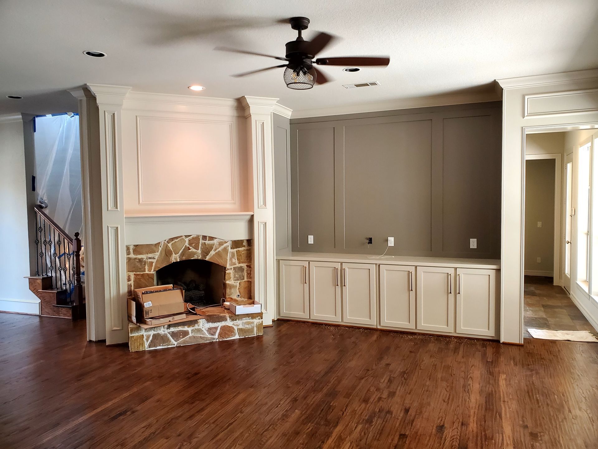 Custom living room built-in cabinet wall with panel design in North Texas