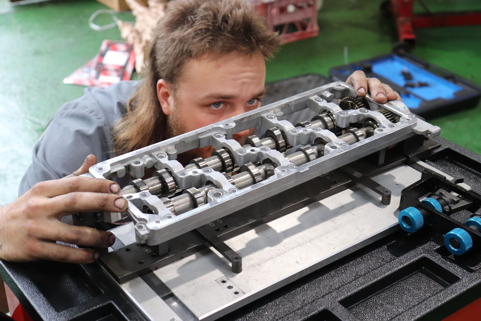 Mechanic Examining Car Engine Cylinder Head — Ballina Car Centre in Ballina, NSW