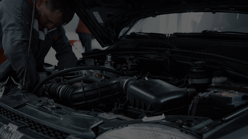 Mechanic Working On Car Engine With Hood Open — Ballina Car Centre in Ballina, NSW