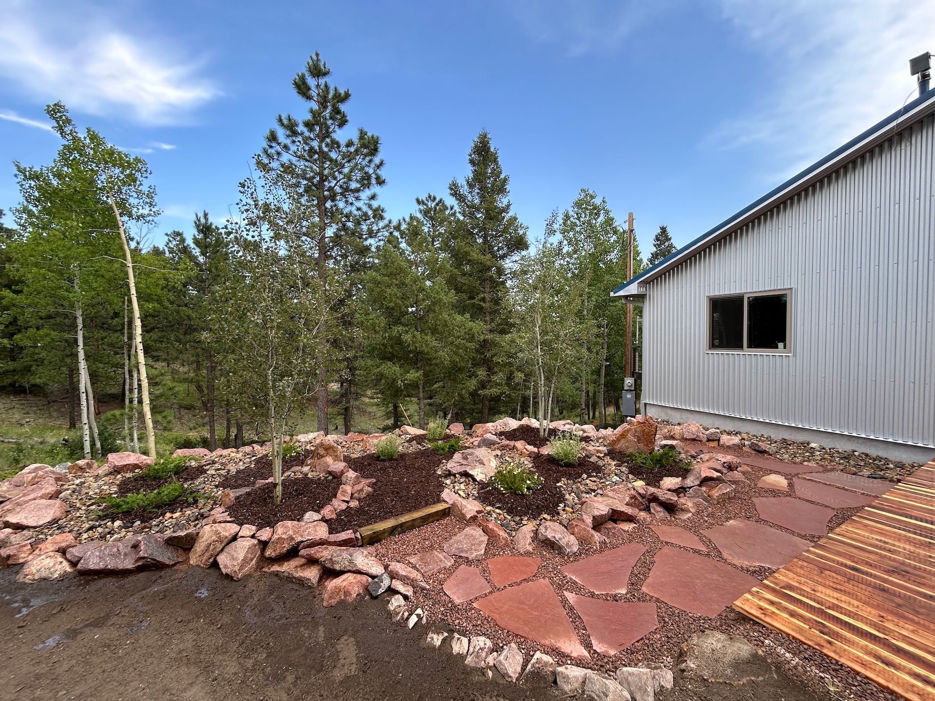 A house with a lot of rocks in front of it