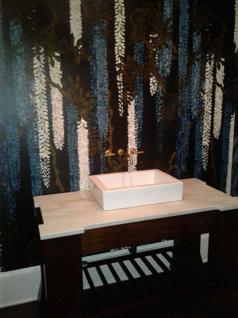new modern style square sink with golden built in wall faucet with granite countertop base, and 4 legged wooden base for a new sink remodel.