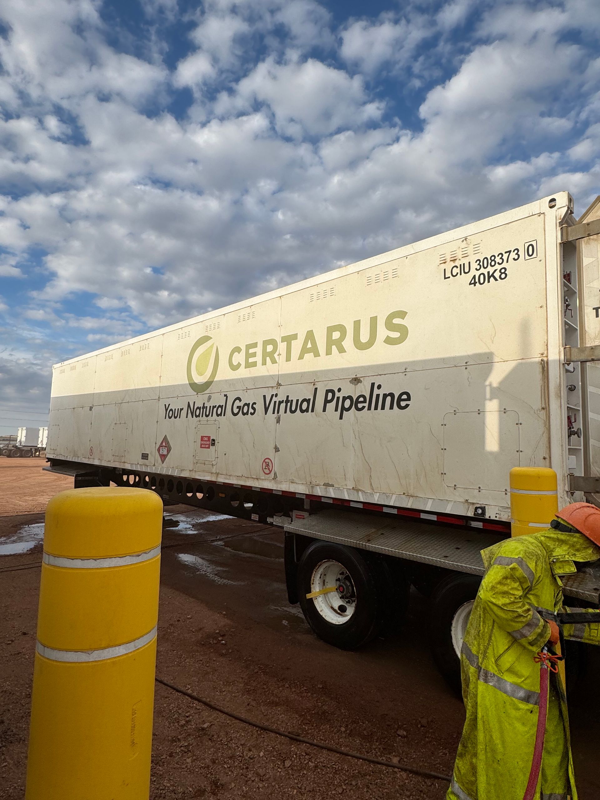 CERTARUS cement mixer truck parked on a wet site under a cloudy sky