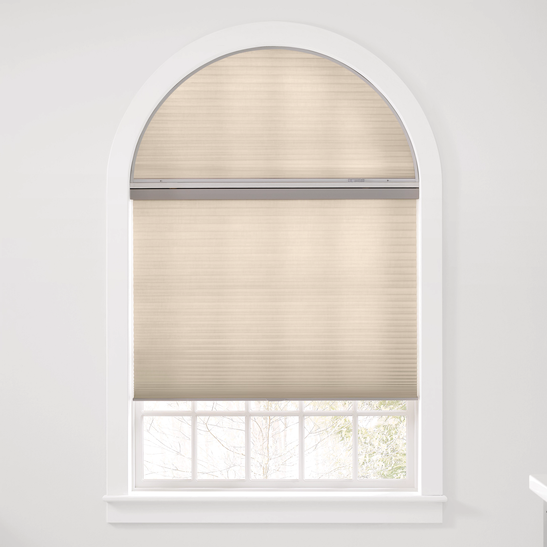 Wooden blinds filtering sunlight in a room with patterned wallpaper and a decorative chair.
