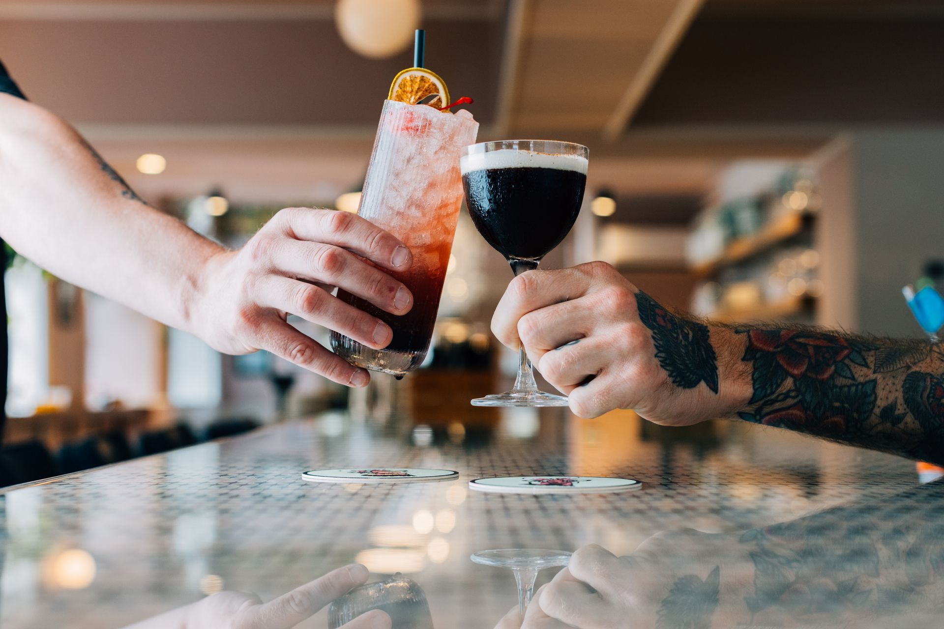 bunny's buckets and bubbles customers holding cocktails