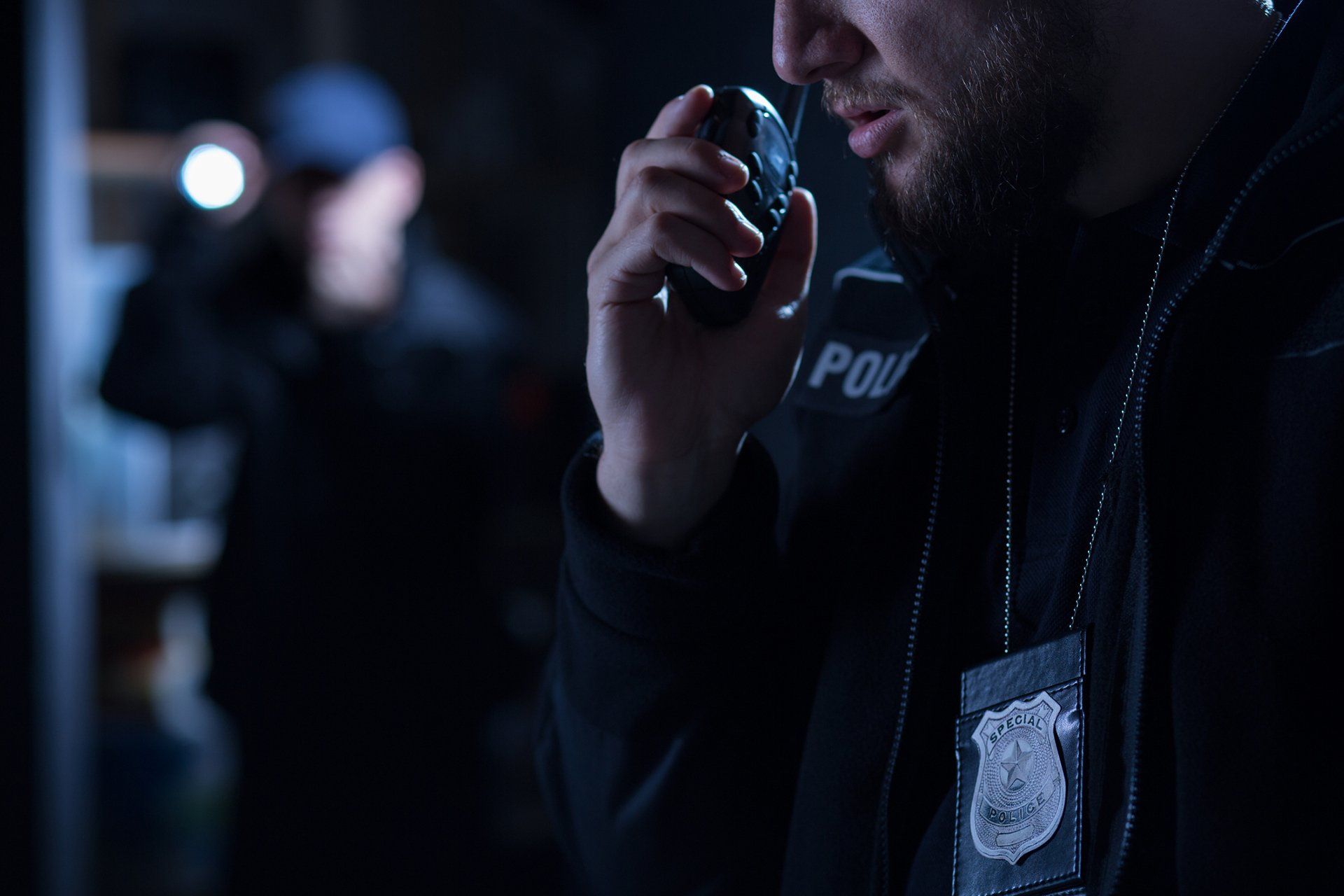 Officer using walkie talkie