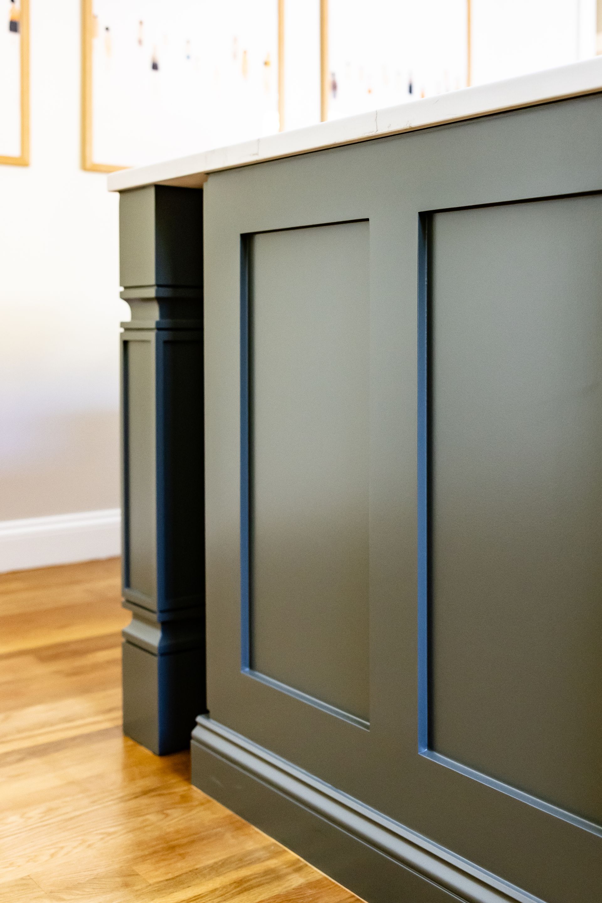 Paneled island end with corner posts