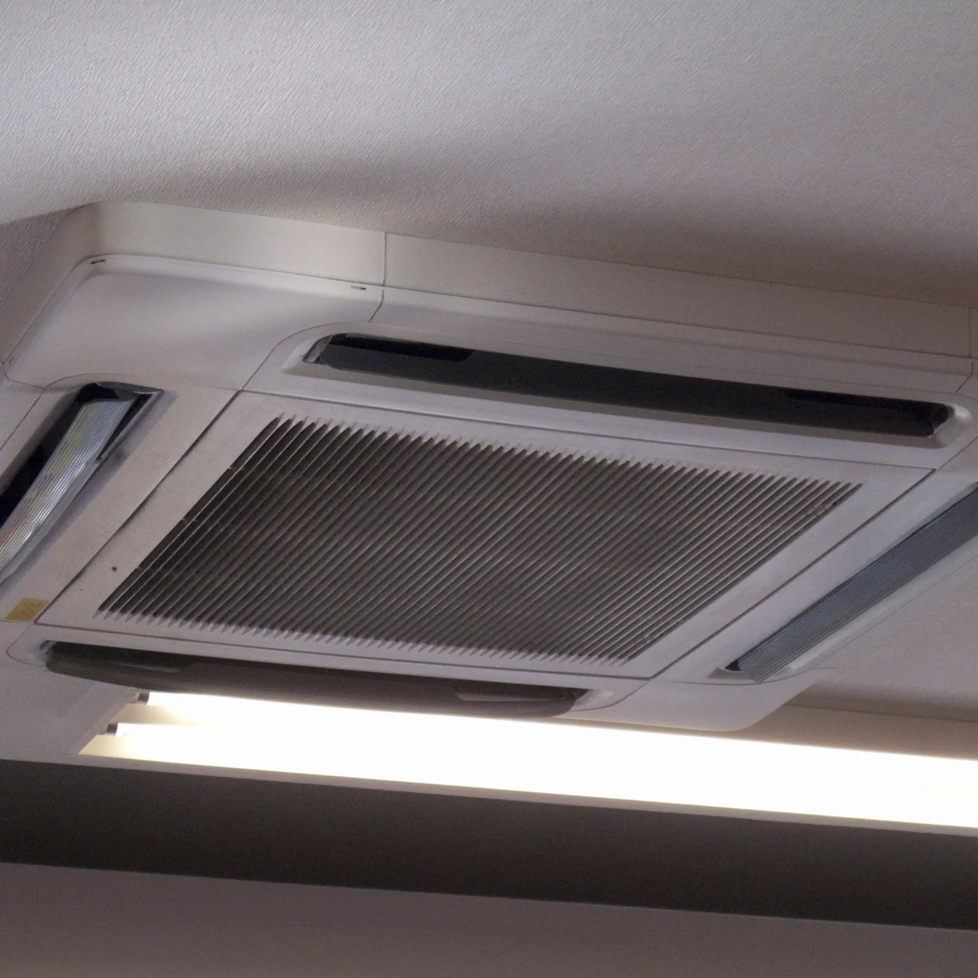 Aarden Air Service Heating & Air Conditioning- An air conditioner is mounted to the ceiling in a room