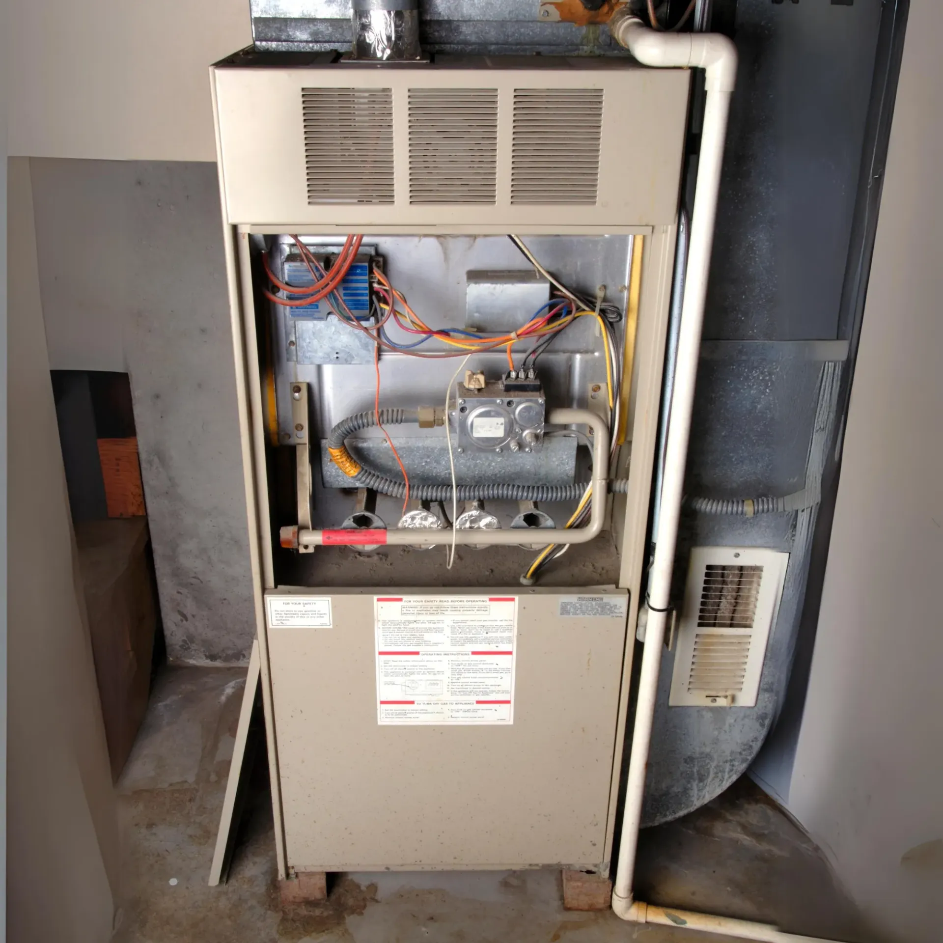 Aarden Air Service Heating & Air Conditioning- The inside of an air conditioner with the door open