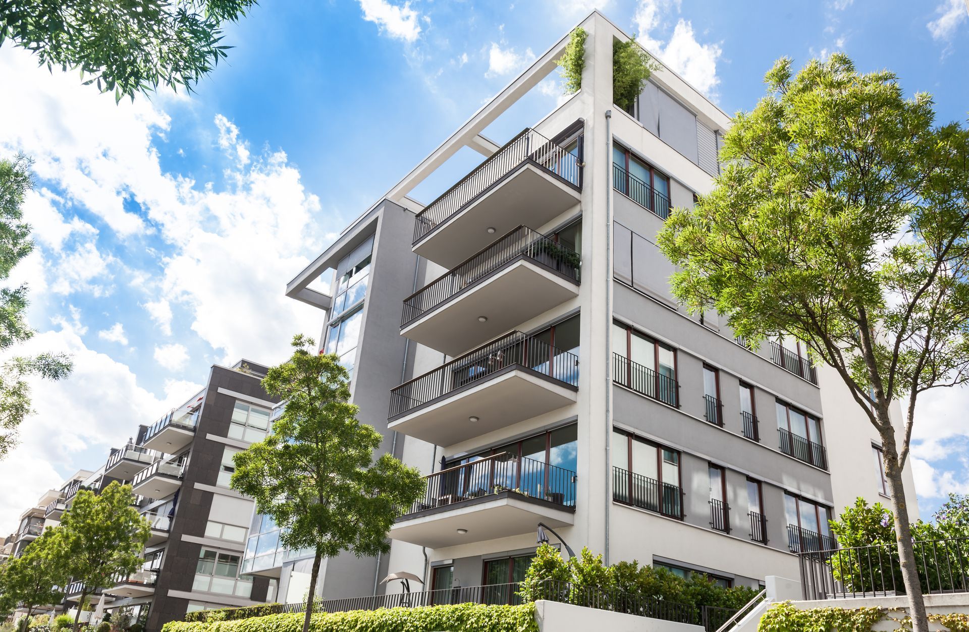 A large apartment building with lots of windows and balconies