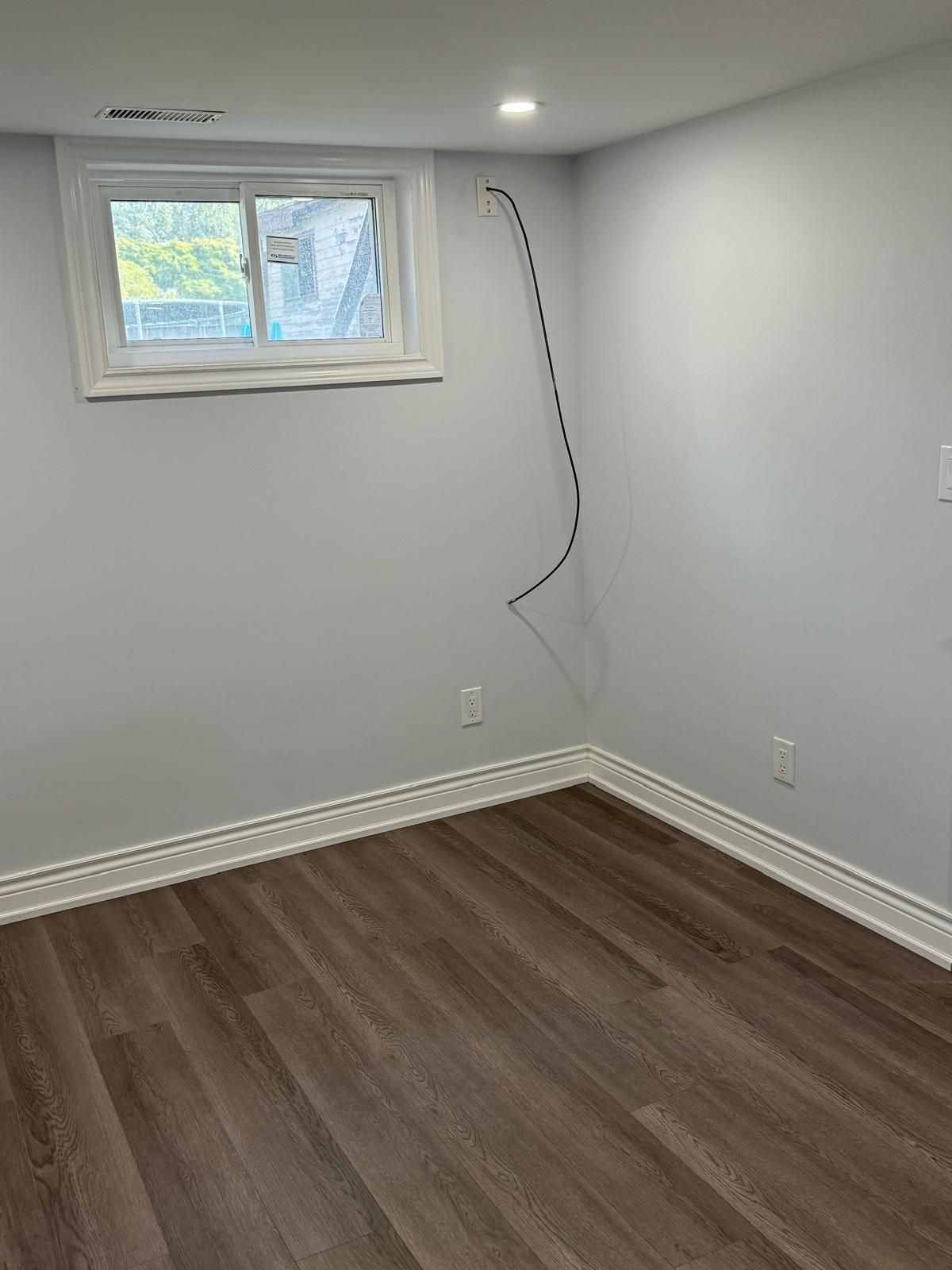 There is a window in the corner of the room.