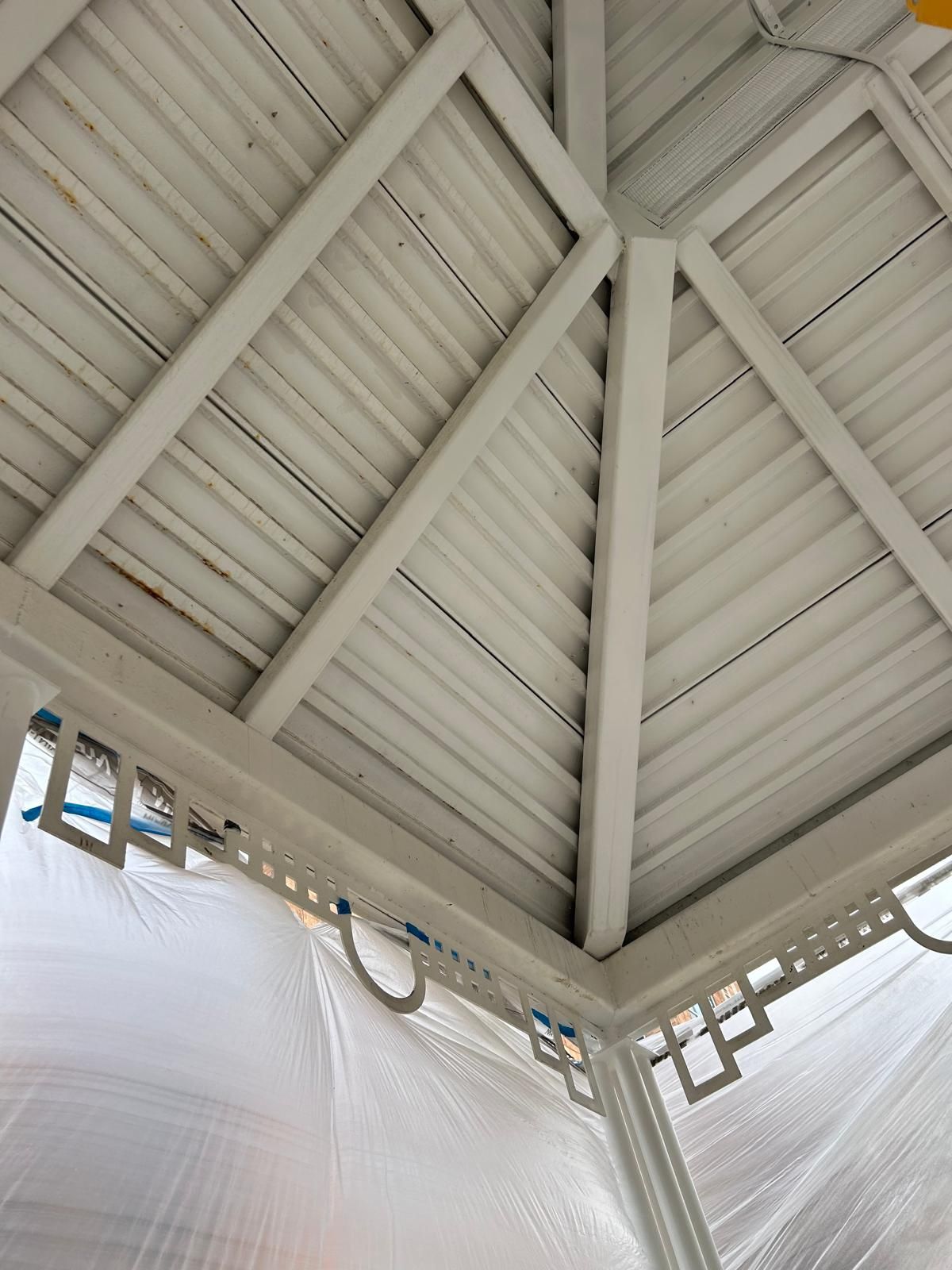 Looking up at the ceiling of a white gazebo