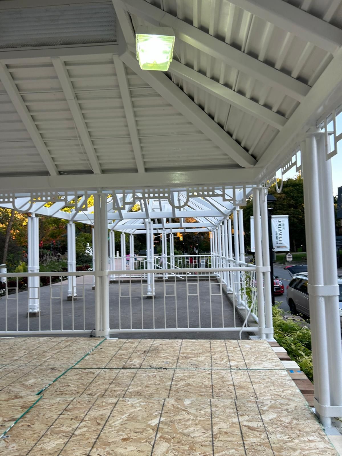 A white gazebo with a sign that says hotel on it