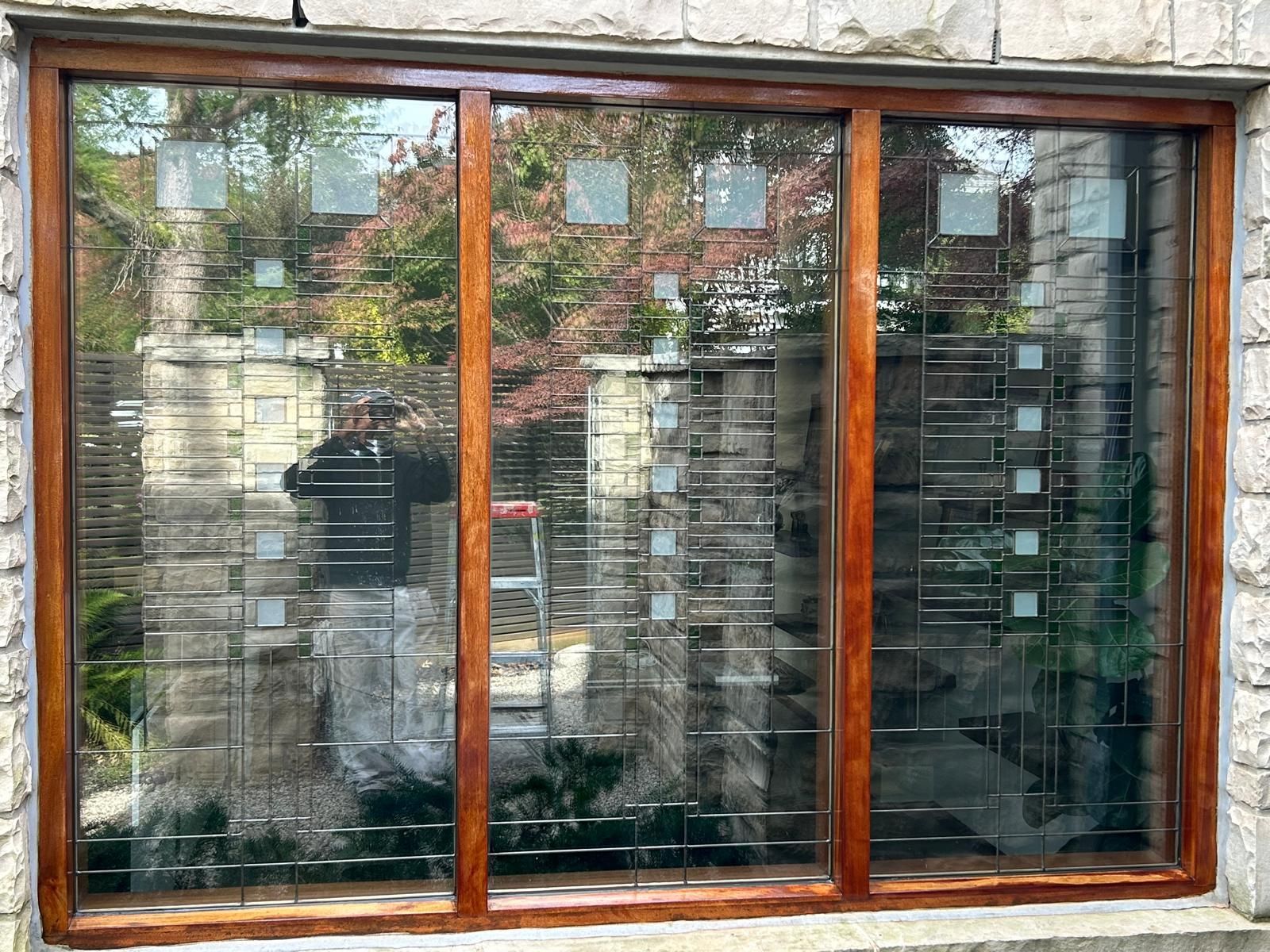 A window with a wooden frame and stained glass