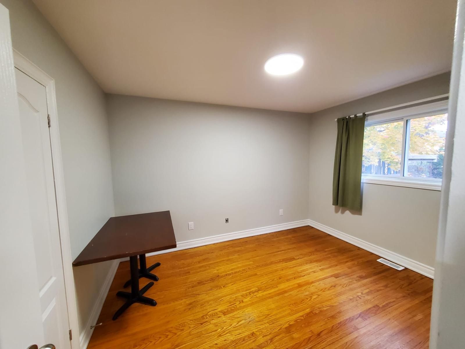 There is a table in the middle of the room.