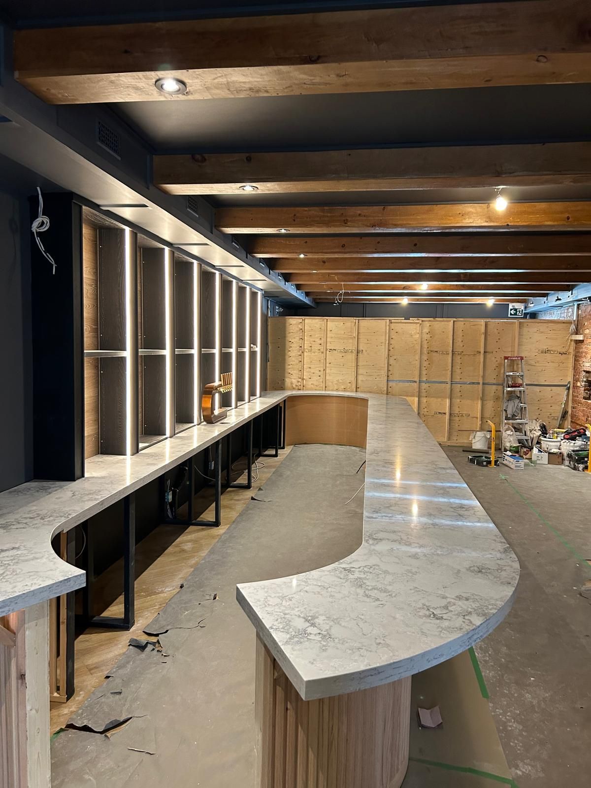 There is a long counter in the middle of the room.